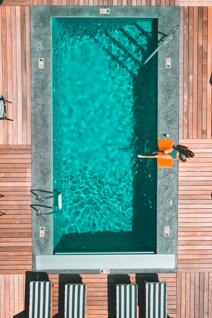 Aerial view of clear turquoise pool water after routine pool maintenance