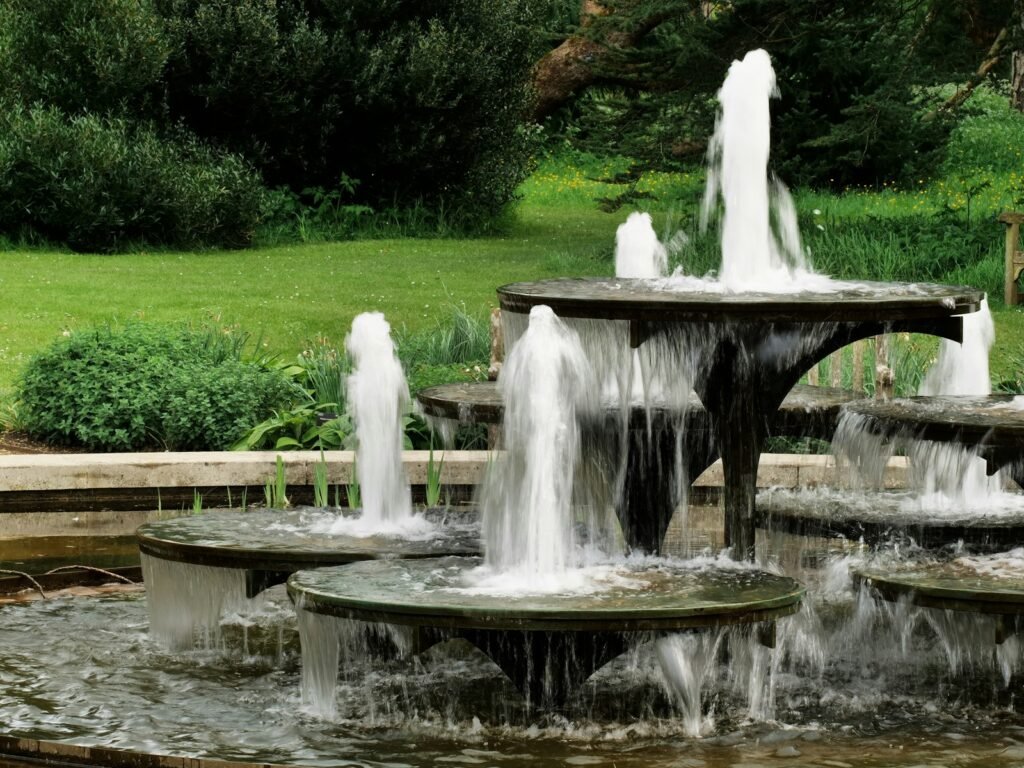 Tiered garden fountain among landscaping