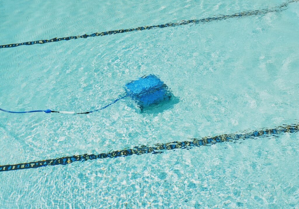 Clean pool floor and clear water supported by a well-maintained filter